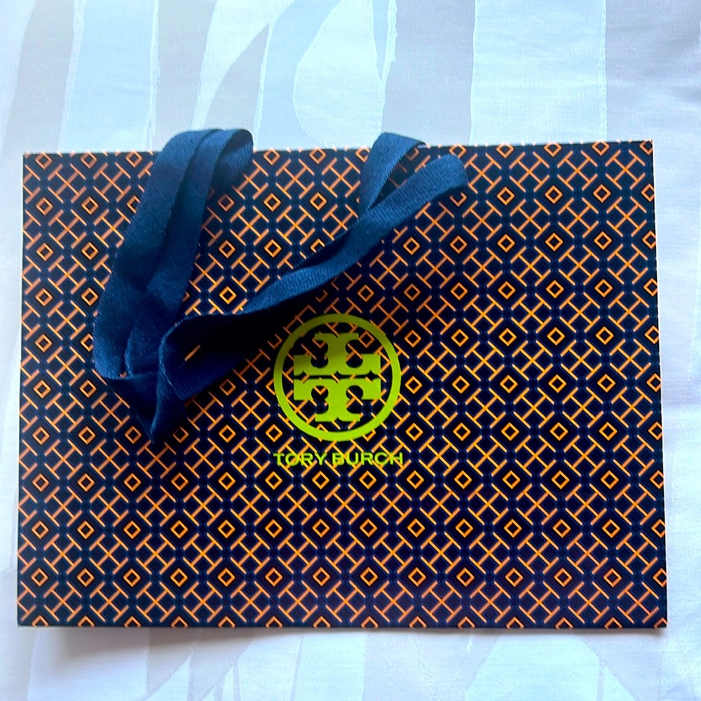 TORY BURCH PAPER BAG. 12 by 9 by 5 inches. Blue handles.